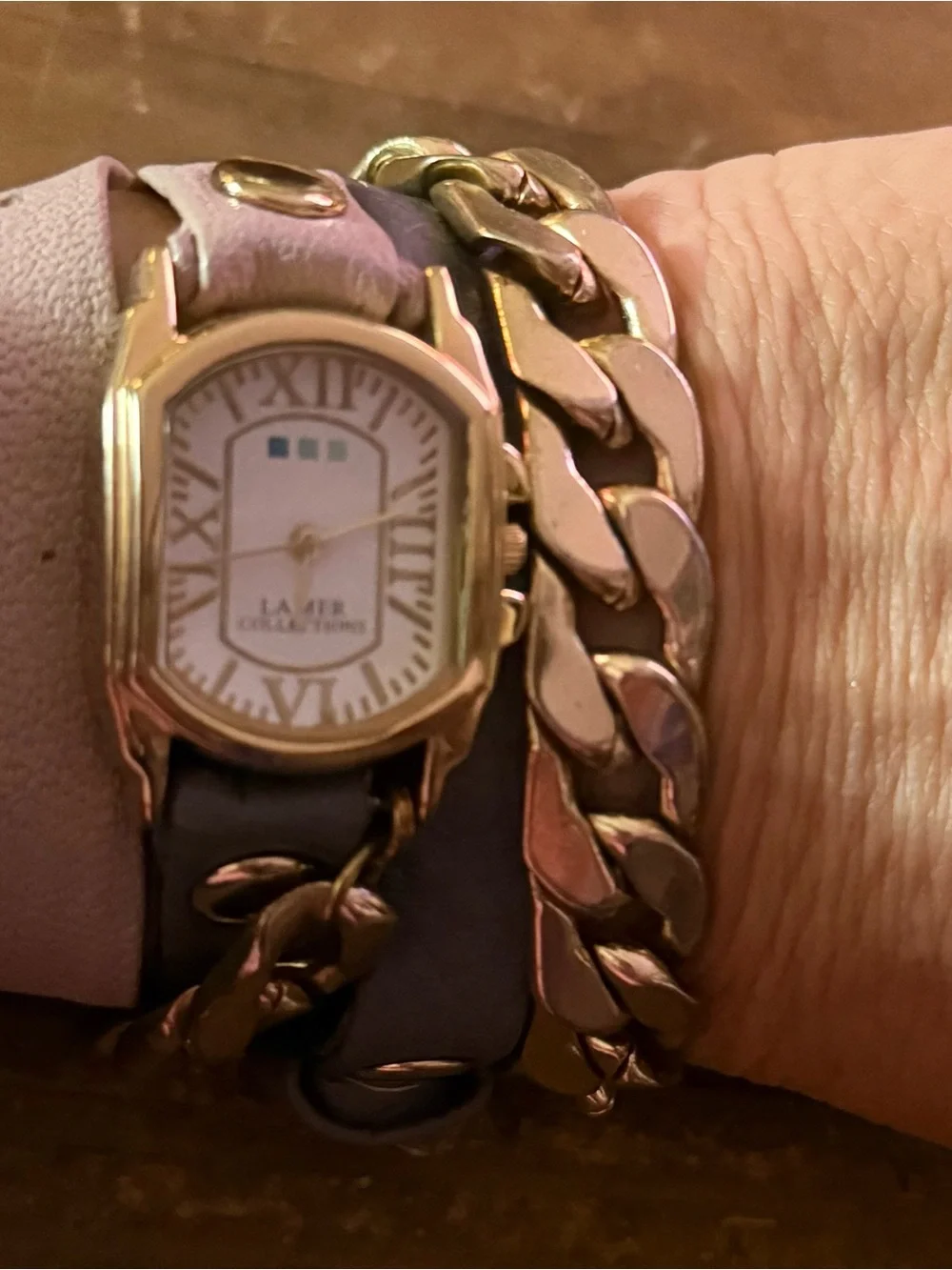 LA Mer Collections gold chain and leather wrap bracelet watch